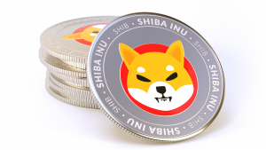 Stack of Shiba Inu coins (SHIB-USD) isolated on white background.