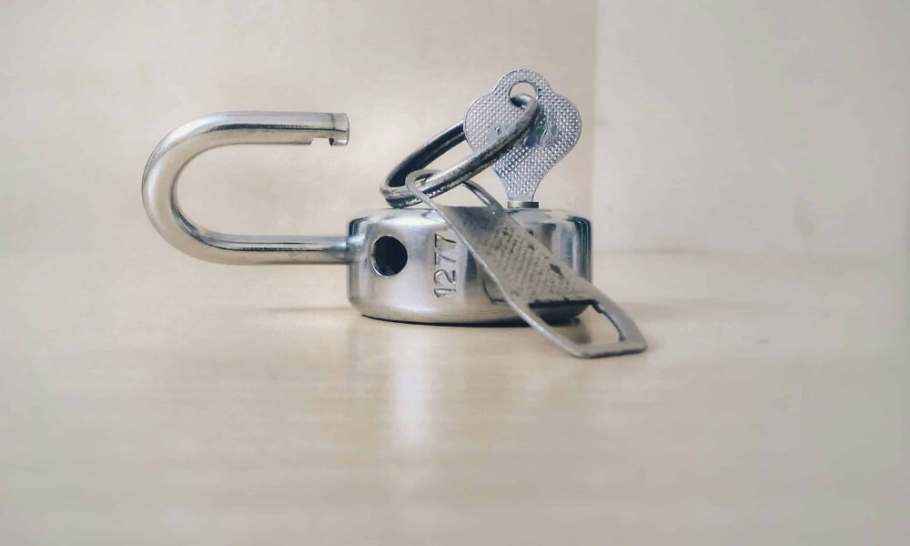 A metal silver lock getting unlocked